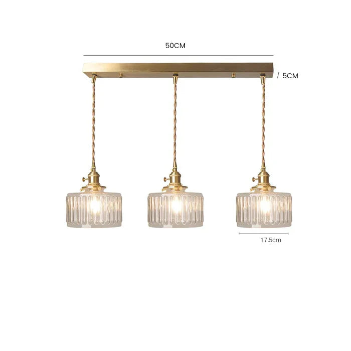 Szklana lampa wisząca w stylu vintage z ryflowanym kloszem i złotym wykończeniem