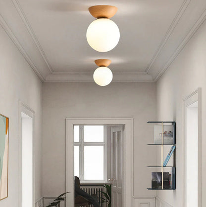 Nowoczesna lampa sufitowa w japońskim stylu  z drewnianą bazą – minimalistyczna kula